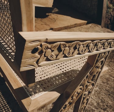 Contemporary chairs made of teak wood and rattan with a combination of distinctive carved ornaments
