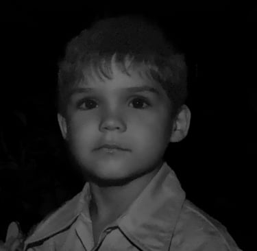 a young boy in a shirt and tie dye dye dye dye dye dye dye dye