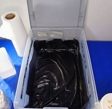 a tubbed lined with a black liner to prevent side pins in mushroom cultivation