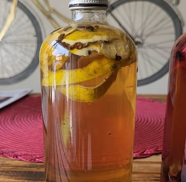 a bottle of kombucha with orange