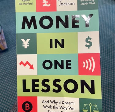 a person holding a book about money