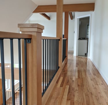 Fir wrapped posts, open iron railing