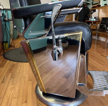 reupholstered vintage Takara Belmont barber chair side view