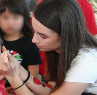 Angelique doing a child's face painting
