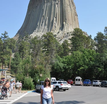 a woman at devils tower, wyoming