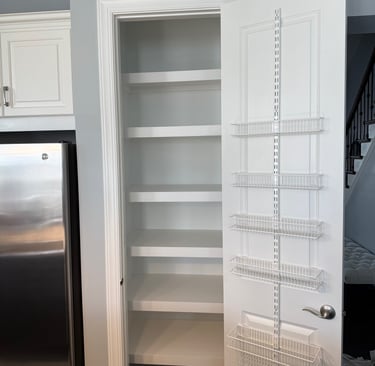 a kitchen pantry with a refrigerator and a refrigerator