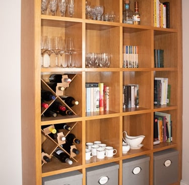This image shows a tall book case and storage unit built from oak veneered board.