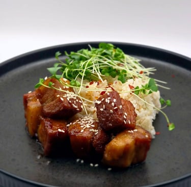 a plate of food with meat and rice