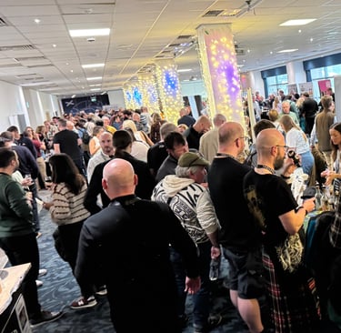 group shot of people at The Edinburgh Whisky Whisky Festival in Edinburgh, Scotland.