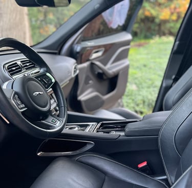 Sanitized SUV interior with clean cupholders and debris-free console