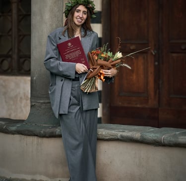 a woman in a suit and a flower crown