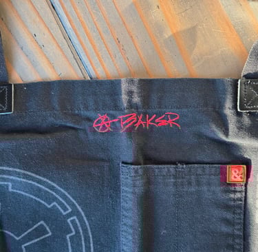 an apron with handwriting embroidered on it