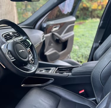 Sanitized SUV interior with clean cupholders and debris-free console