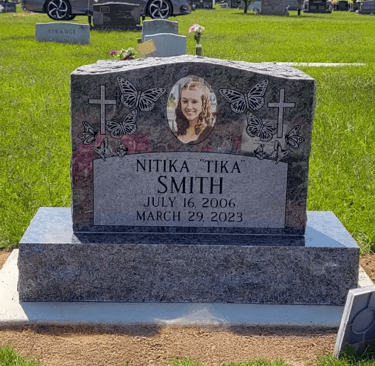 single upright tombstone in bahama blue granite with porcelain memorial portrait