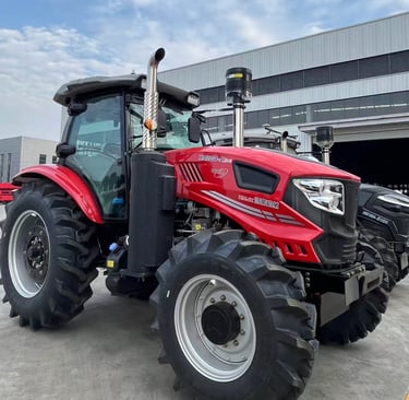 a red tractor with a large wheel on it