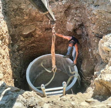 Septic tank installation at a construction site