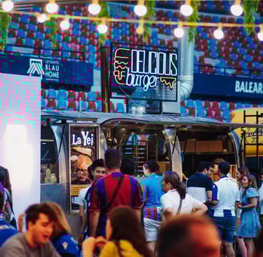 a group of people sitting at tables in a restaurant