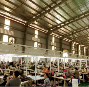 Skilled workers at a sewing production line in King Fly's manufacturing network.