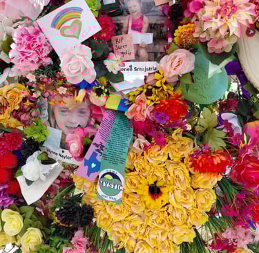 Memorial flowers with young girl's picture among the flood victims