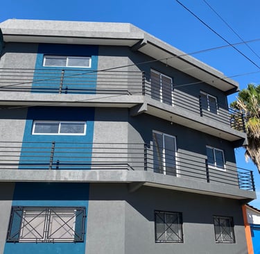 COndominio contruccion de deartamentos con revestimiento texturado a llana rulato azul y gris claro