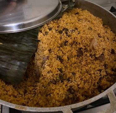 a pot of arroz con gandules with banana leaf