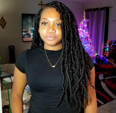 a woman with long black locs 