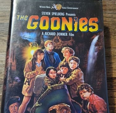 Alt text: Sealed vintage VHS of The Goonies, a classic 80s adventure film.