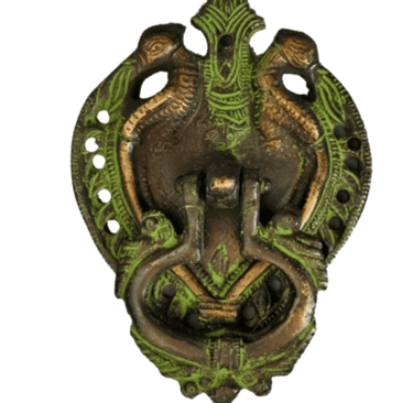a metal wall mounted with a green dragonfly