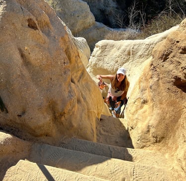 the author's mother climbing the staircase at the end of Annie's Canyon Trail. 