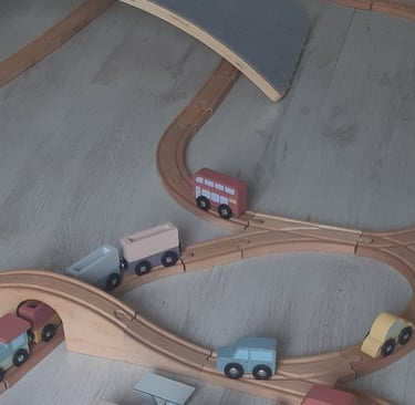 a train set up on a wooden train track
