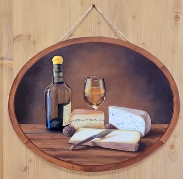 Médaillon peint en trompe-l'oeil sur une porte en bois. Il représente le terroir du Jura: vin Jaune.