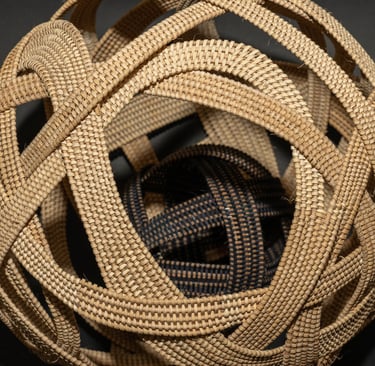 woven sphere black and white contained basket within a basket orb sculpture woven art contemporary complex