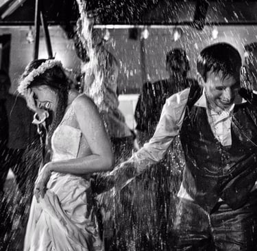 Bride and Groom having fun in the rain