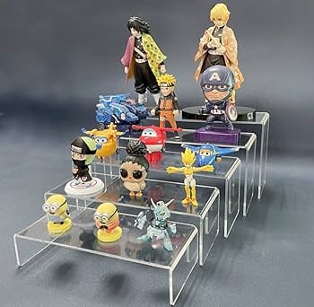 Clear acrylic risers showcasing assorted anime figures in a tiered display arrangement.