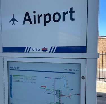 UTA Trax Airport Station sign and system map