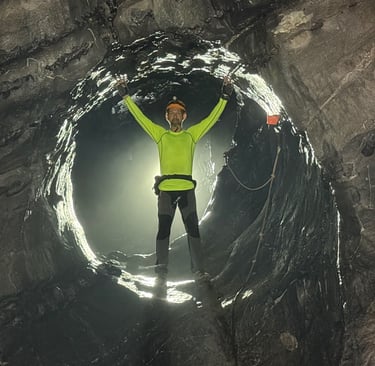 Nick Billington climbing through the James Bond hole in Hang Son Doong Cave to get to doline 1