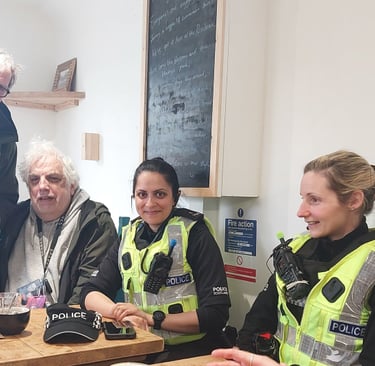 Members of the public with community policing team in coffee shop