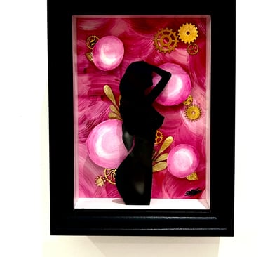 a woman in a black dress standing in front of a pink flower