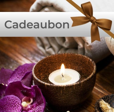 a spa with candles purlple lilly and the message giftcard