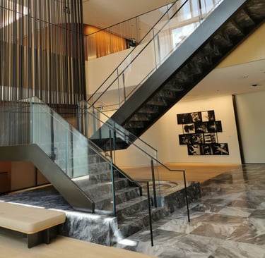 Second angle of Scotiabank North marble feature stairs, by by Pengelly Iron Works