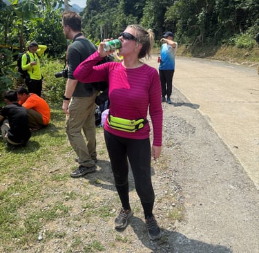 Trace Billington enjoying a cold beer after completing the Hang Son Doong Cave expedition in Vietnam