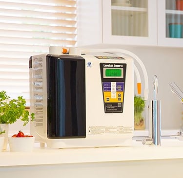 Enagic Super 501 Kangen Water ionizer on countertop featuring 7 & 5 platinum-plated titanium plates