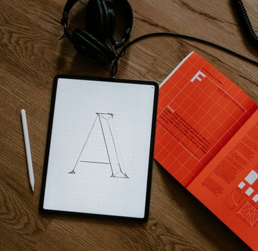 a tablet with a tablet and headphones on a table