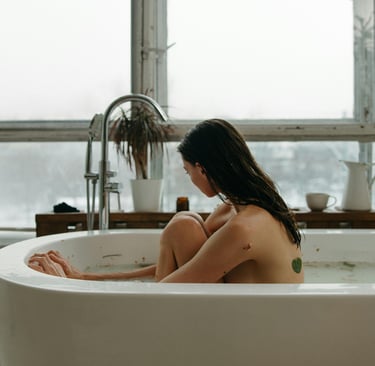 a woman sitting in a bathtub