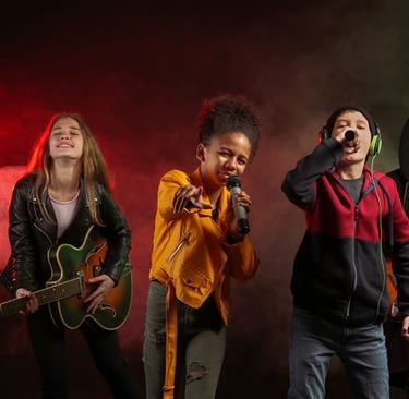 a group of kids singing and playing guitar