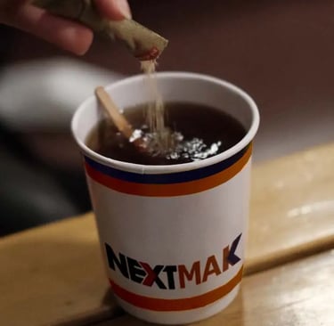Purring a sugar into a tea cup