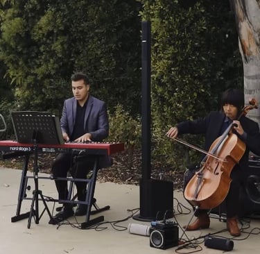 Pianist Daine Jordan and cellist Hitoshi Suzuki play together on a wedding gig