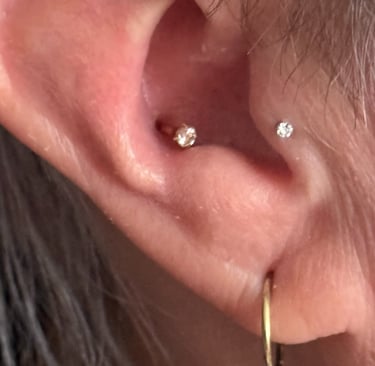 Licensed piercer giving aftercare advice in Stonehaven