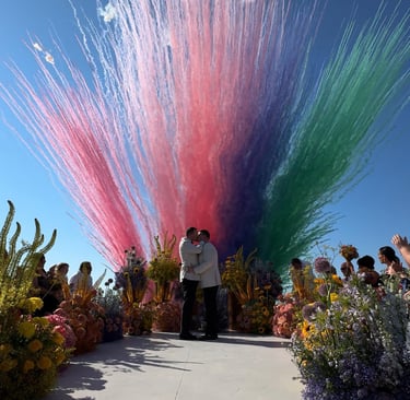 Bright, multicolored fireworks during a daytime wedding celebration
