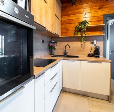 a kitchen with a stove top oven and a microwave